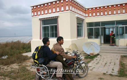 Tibetan ride a motobike