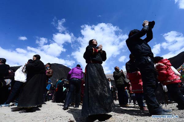 Citizens of the Tibetan ethnic group pray