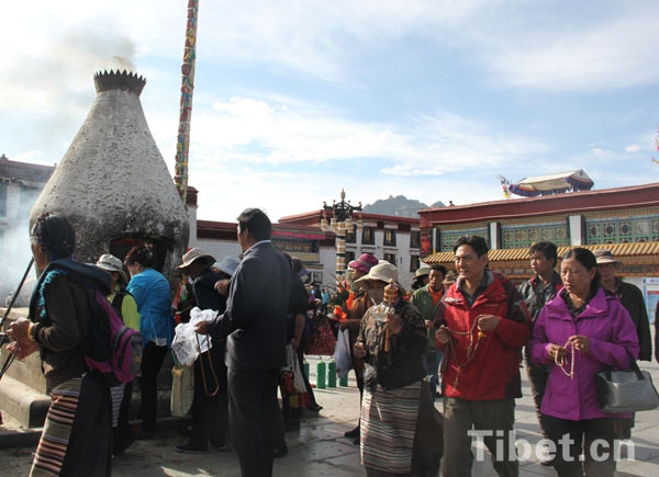 believers take ritual walk around the Jokhang Temple in the Barkhor Street in Lhasa.
