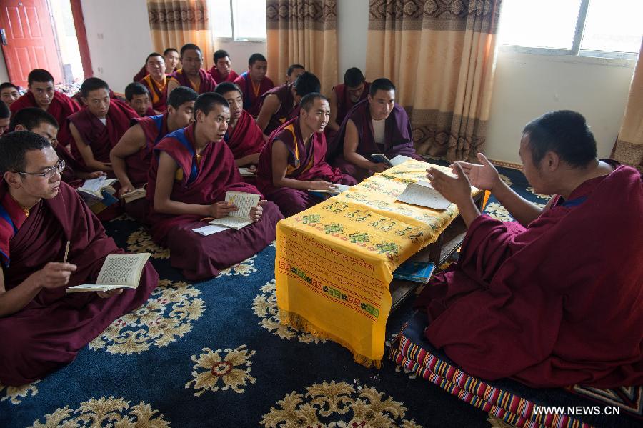 Monks have a Buddhism class at Qamdo Monastery