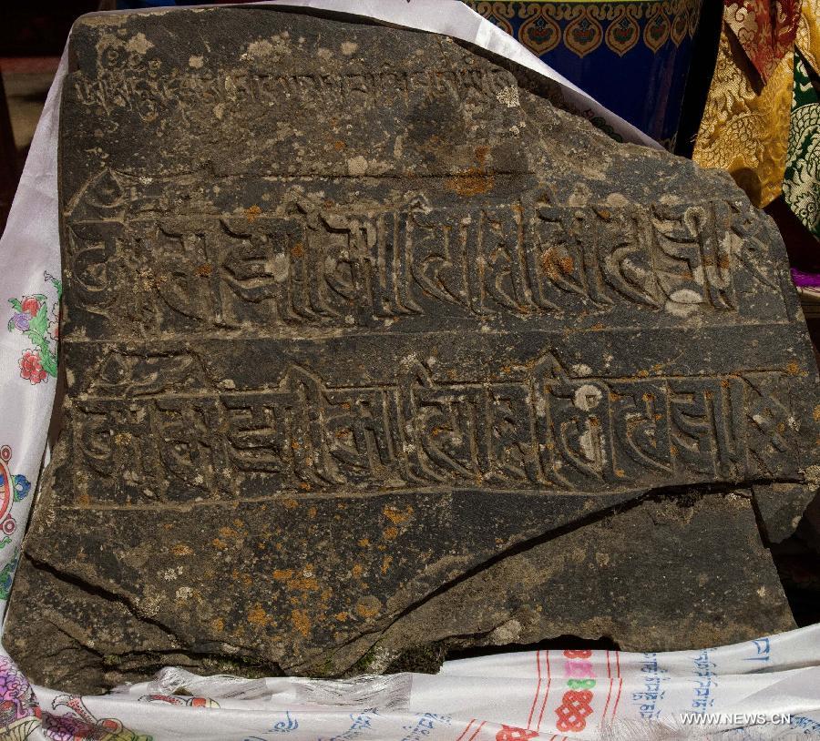 a 1,000-year-old Bonpo Sect stone-carved scripture at Qamdo Monastery
