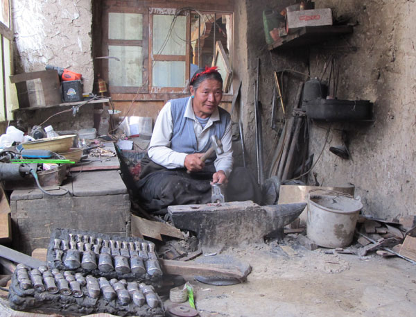 Budawa is making a sheath at his workshop. He was accredited as the "representative inheritor" of Lhaze Tibetan knife making by an intangible cultural heritage project in the Tibet autonomous region in 2008. Palden Nyima