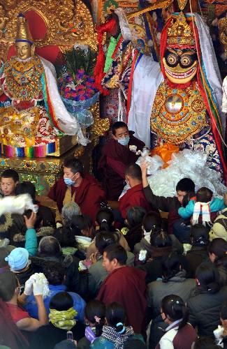Tibetan Buddhism believers are praying in the Jokhang Temple during the Goddess Festival.