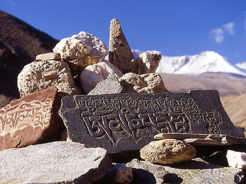 Most Tibetan stone carvings are on ordinary rocks, stones and pebbles