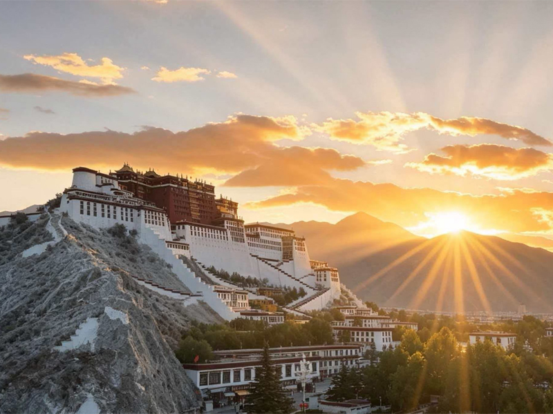 Potala Palace Sunrise in Lhasa, Tibet Potala Palace in Lhasa, Tibet at sunrise with golden sunlight over mountains
