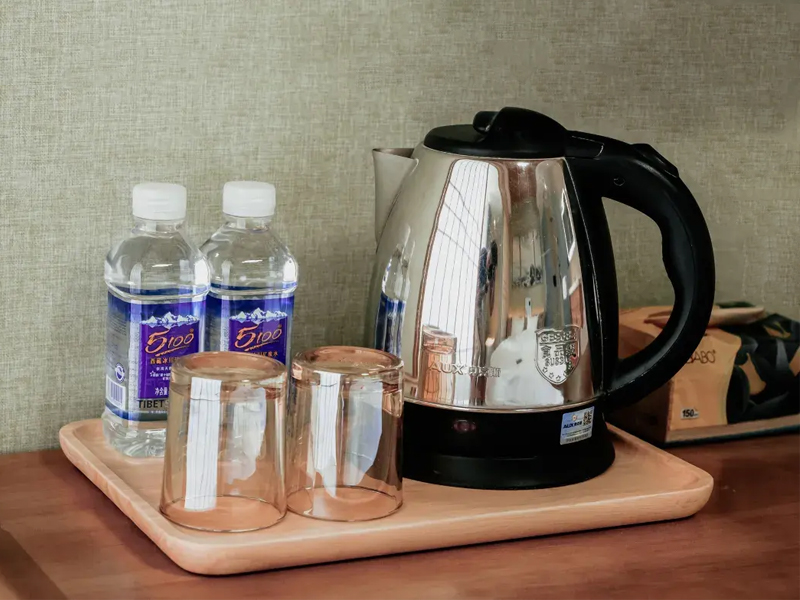 Bottled Water and Electric Kettle in a Tibet Hotel Bottled water and an electric kettle in a Tibet hotel room
