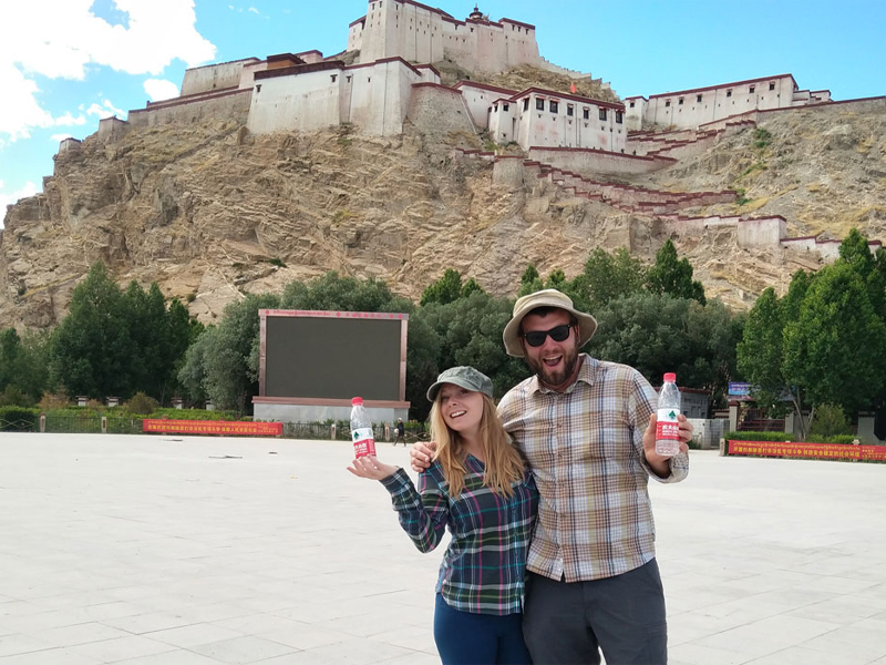 Drinking Bottled Water in Tibet Travelers drinking bottled water in Tibet