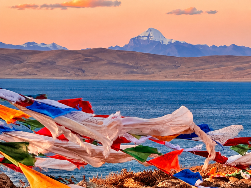 Prayer Flags near Sacred Mount Kailash Tibetan prayer flags with Mount Kailash and a sacred lake