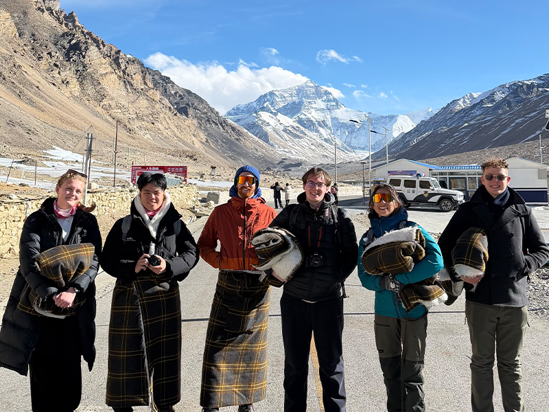Winter Tour to Tibet Everest Base Camp Travelers visiting Tibet Everest Base Camp in winter with Mount Everest in the background