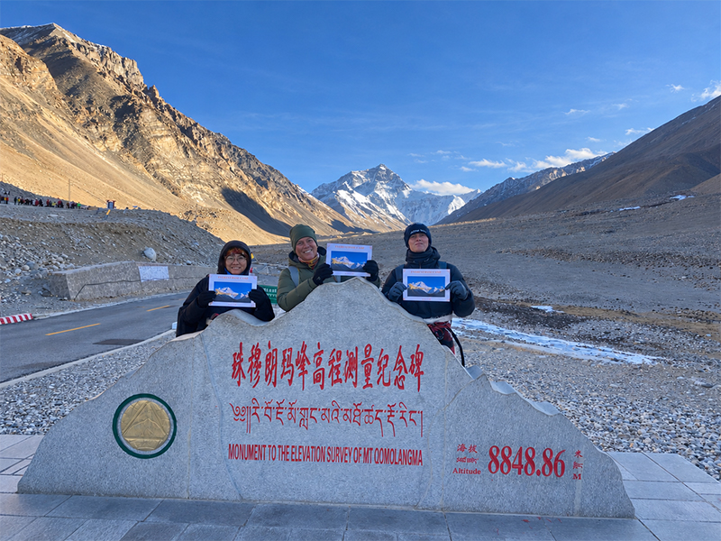 Winter Visit to Mount Everest Elevation Monument Travelers posing at the Mount Everest elevation monument during a winter EBC tour